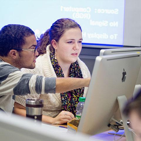 students working on computer